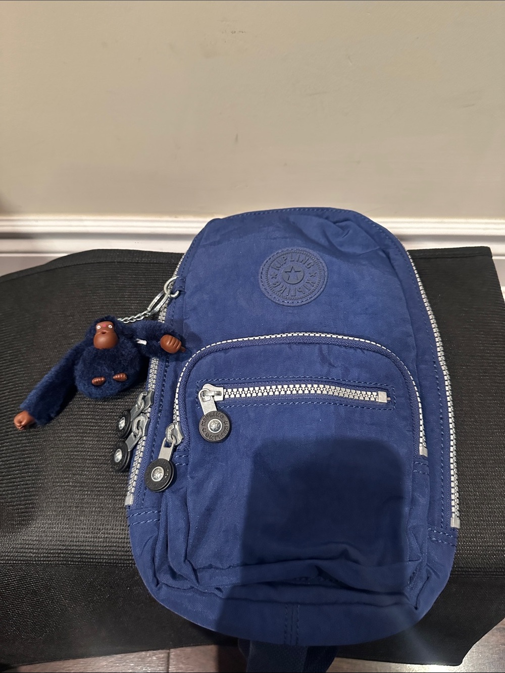 Kipling Navy Blue Sling Belt Bag with Monkey Charm